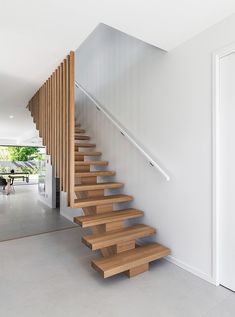 there is a wooden stair case in the house