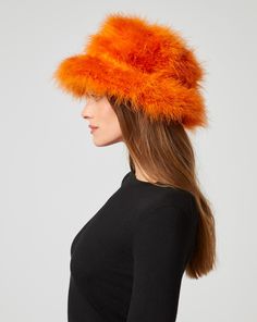 Luxurious marabou feathers find a new home in this bucket hat. Not only does it keep you warm in cooler months, it makes a stylish addition to brunch or lunch on the town. Marabou Feathers, Jumpsuit Jacket, Outerwear Vest, Fall Collections, Sweater Skirt, Skirt Pants, Jacket Tops, Vest Jacket, Sweater Top