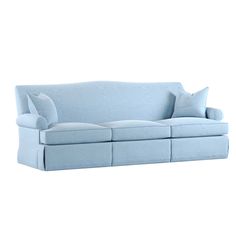 a blue couch sitting on top of a white floor