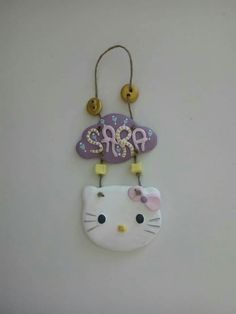 a hello kitty decoration hanging on the wall