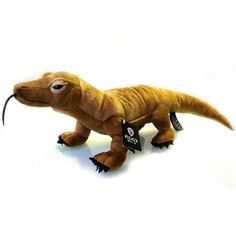 an image of a stuffed toy dinosaur with tags on it's legs and feet