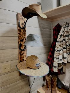 a hat and coat rack in a small room