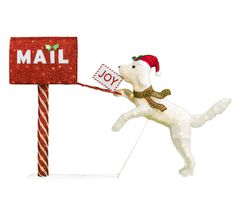 a white dog in a santa hat pulling a mailbox with it's tail