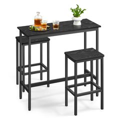 three stools and a table with drinks on it in front of a white background