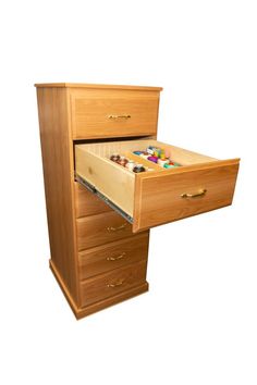 an open drawer on top of a wooden desk with buttons in the bottom drawer and two drawers below it