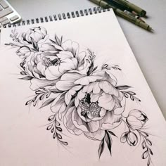 a drawing of some flowers on a piece of paper