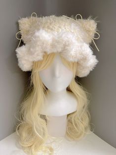 a wig with long blonde hair wearing a white hat