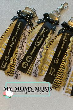 four black and gold ribbon key chains with the word mom's mums on them