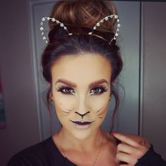 Add a pair of rhinestone-studded ears to finish off your cat costume. Cat Face Makeup, Carnaval Make-up, Make Up Diy, Cat Halloween Makeup, Make Carnaval, Halloweenský Makeup, Halloween Make-up Looks, Halloween Costumes For Work, Pumpkin Halloween Costume