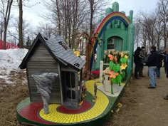 a small house made out of legos in the woods