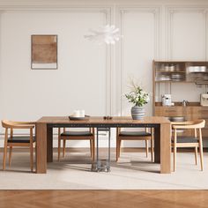 a dining room table with chairs and a potted plant