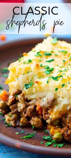 a close up of a plate of food with mashed potatoes and meat on it