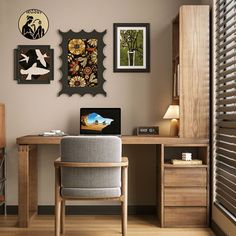 a desk with a chair and some pictures on the wall above it in a room