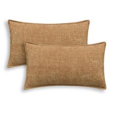 two brown pillows on a white background