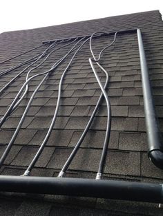 an image of a roof that has some wires attached to it