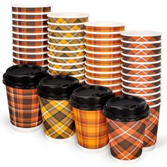 many different plaid coffee cups are stacked together