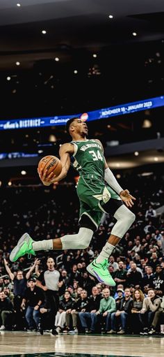 a basketball player jumping up in the air