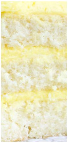 a piece of yellow cake with white frosting