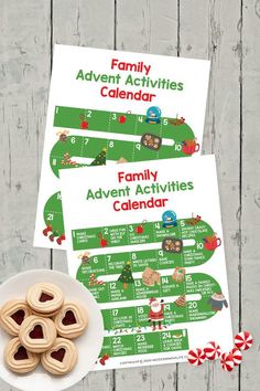 two printable christmas calendars with cookies and candy on a plate next to them