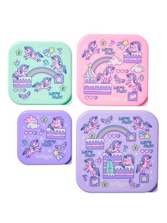 three little trays that have unicorn designs on the front and one has an image of a