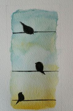 two birds are sitting on wires in the sky