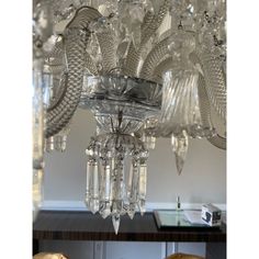 a chandelier hanging from the ceiling in a room