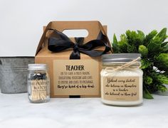 the teacher gift set includes two mason jars and a box