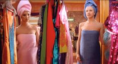 two women in towels standing next to each other