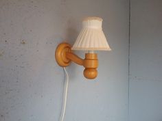 The wall lamp is manufactured in the 1970s by the Swedish company Solbacken. There is an on/off power switch on the cable. The plug is European and the socket fits E14 bulbs (bulb not included). The wall lamp has a light rubbing on the body under the bulb holder and a dent on the plate adjacent to the wall - I have shown this in the last photo. It can be placed in the bedroom above the bed and will be a bedside lamp, in the hallway, living room or dining room, but would also work well in any oth Arum Wall Lamp, Brass Plug In Sconces, Wall Mount Lamp With Curved Arm, Lamp Scandinavian, Swedish Wall, Ferm Living Wall Lamp, Wall Lamp Modern, Wall Lamp Plug In Gold, Modern Wall Lamp