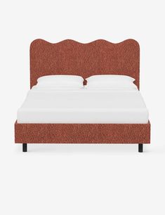 a bed with an orange headboard and foot board on it's side, against a white background