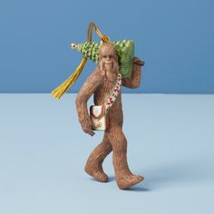 a figurine of a man with a tree on his back