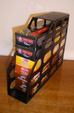 a stack of coffee boxes sitting on top of a wooden floor