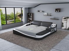 a modern style bedroom with grey walls and carpeted flooring, large window overlooking the outdoors