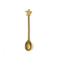 a gold spoon with a star on it