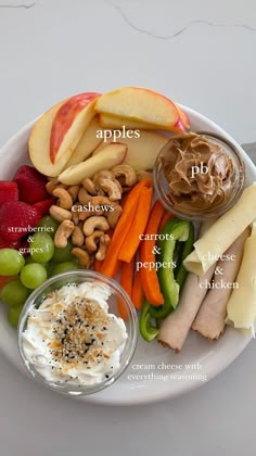 a white plate topped with fruits and vegetables