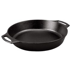 an empty frying pan on a white background