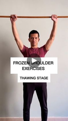 a man holding up a bar with the words frozen shoulder exercises in front of him