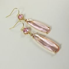 Soft Pink Crystal Earrings, Gold Dainty Pink Teardrop Earrings, Sparkly Dangle Earrings, Wedding Jewelry, Bridesmaid Gift, Pink Earrings. These beautiful and elegant drop earrings made with high quality, sparkly 24k gold framed, faceted pink glass crystals hang from tarnish resistant French ear hooks. These earrings are classic and elegant. Will make an excellent gift for yourself or friends. Measurements: The total length from the top of the hook to bottom - 2.04 inches (52 mm) approximately. C Feminine Drop Earrings For Bridal Party, Elegant Pink Long Drop Earrings, Feminine Dangle Bridal Earrings For Party, Delicate Linear Drop Earrings For Formal Occasions, Elegant Pink Chandelier Earrings For Formal Occasions, Elegant Pink Chandelier Earrings For Formal Events, Formal Pink Chandelier Earrings, Elegant Rose Gold Long Drop Earrings, Elegant Pink Bridal Earrings