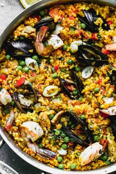 an image of spanish paella with shrimp and mussels