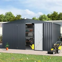 two garages with one door open and the other side opened to reveal a lawn mower