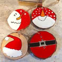 three christmas ornaments are sitting on a table