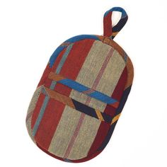 a red, brown and blue striped pot holder with a knot at the top on a white background