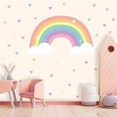 a child's room with hearts and a rainbow wall decal