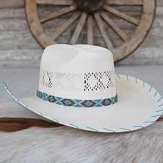 The Charlie 1 Horse Apache Jr. Children's Straw Cowgirl Hat is a delightful fusion of playful colors, charming patterns, and classic cowboy style. This vibrant hat features a multicolored patterned beaded hatband, a 4 1/8" cattleman crown for a stylish silhouette, and a 4" brim adorned with turquoise whip-stitched edges for a touch of elegance. Designed for young cowgirls who embody the spirit of adventure and joy.Fits up to 55.5 cm 4"Brim 4 1/8"Crown Color: White Staw Girls Cowboy Hats, Straw Cowgirl Hat, Beaded Hat Bands, Playful Colors, A T, Classic Cowboy, Straw Cowboy Hat, Beaded Hat, Cowgirl Hat