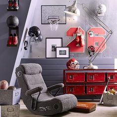 a living room filled with furniture and pictures on the wall next to a stair case