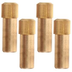 four brass knobs are shown on a white background