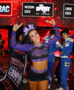 a group of cheerleaders are dancing together