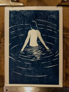 an image of a woman in the water with her back turned to look like she is floating