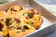 broccoli, bacon and cheese muffins in a metal pan on a table