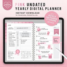 the pink undated year - by - date planner is displayed on a tablet screen